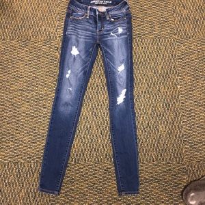 Acid washed ripped jeans